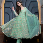 Green and gold-toned embroidered semi-stitched dress material